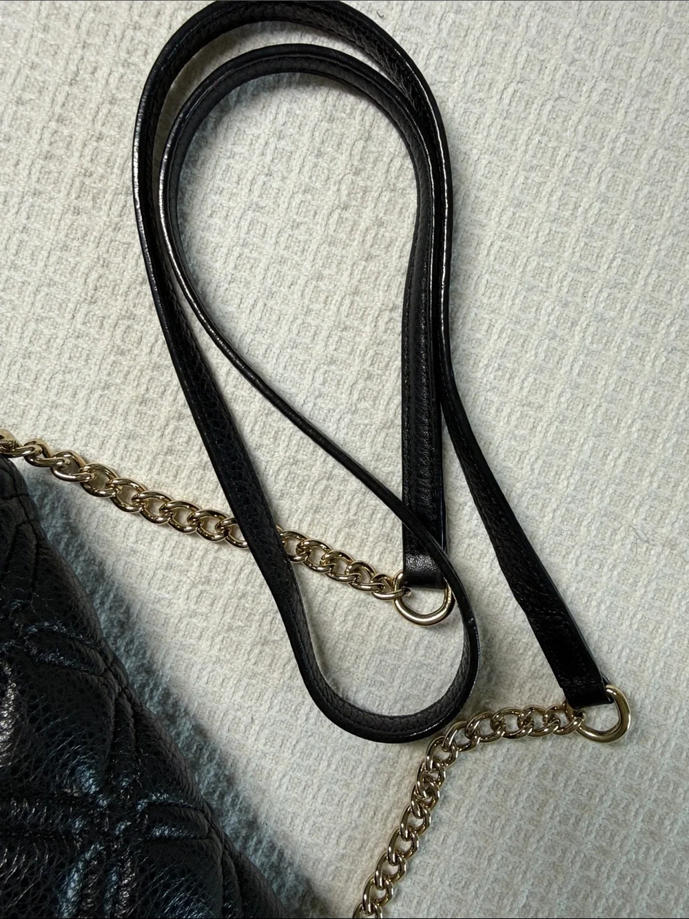 Kate Spade black quilted leather crossbody bag with gold chain and hardware